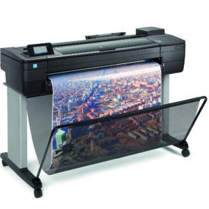 HP DesignJet T730 - photo shows the printer with a printout dropping into the media basket below, giving an impression of the size of printer and the capability and typical user output