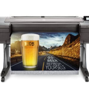 HP DesignJet Z6ps 44-in A0 printer - photo shows the printer with a printout dropping into the media basket and gives an impression of the size of the printer and the capability and typical user output
