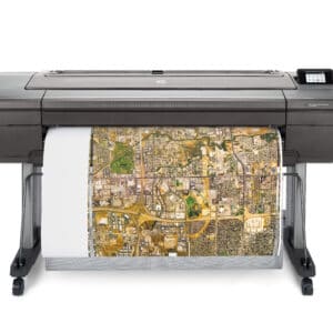 HP DesignJet Z6ps 44-in A0 printer - photo shows the printer with a printout being trimmed vertically and gives an impression of the size of the printer and the capability and typical user output
